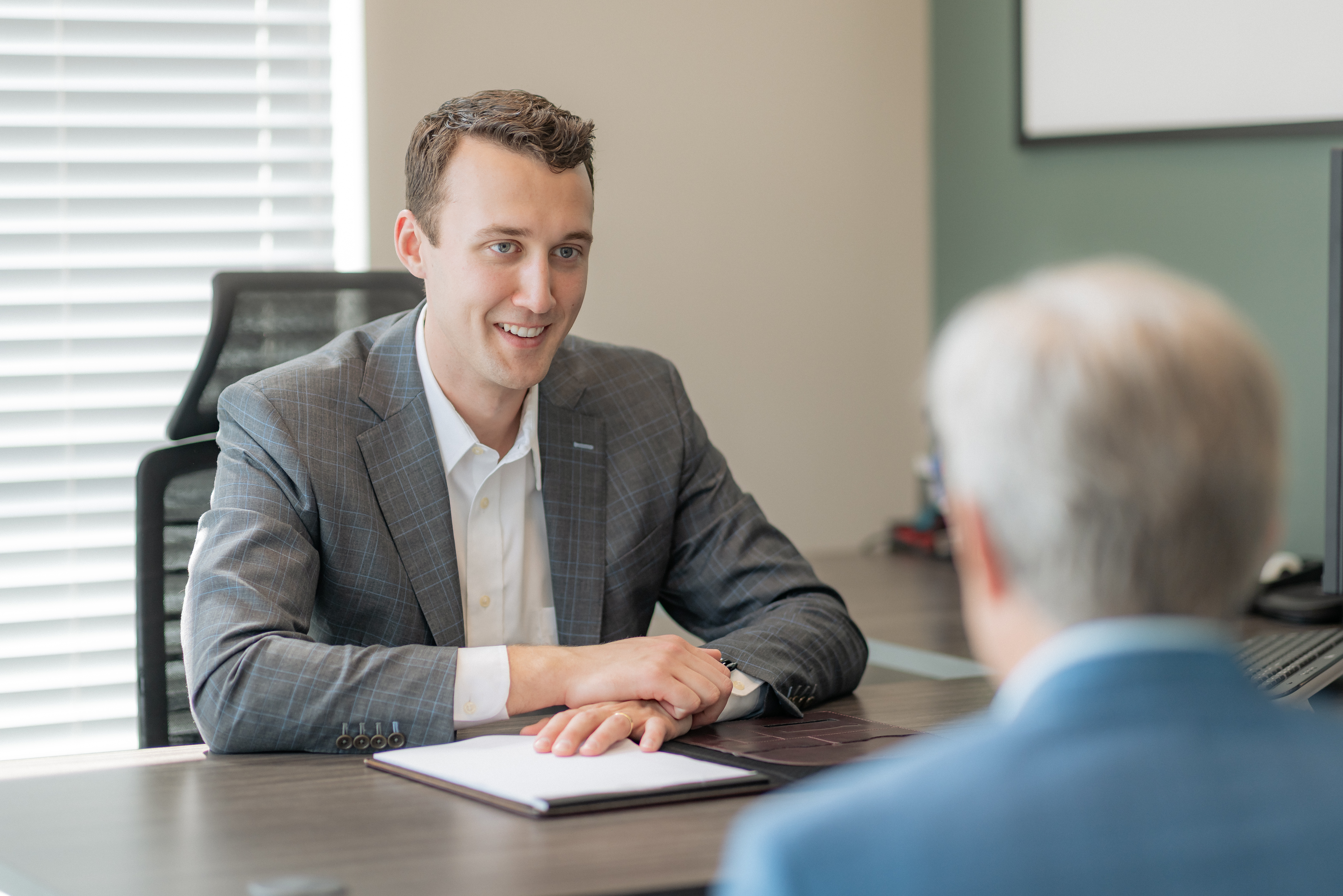 Jack Miller meeting with a client